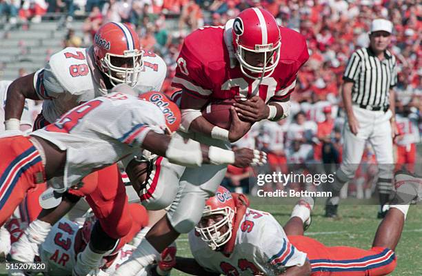 Georgia freshman running back Keith Hernandez gets a short gain against University of Florida defenders Tommy Duhart , Jay Baker , and Alonzo Johnson...