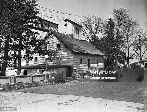 Grover's Mill, biggest employment center of the town of the same name, is shown intact the day after the town was supposed to have been "destroyed by...