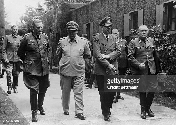 Wilhelm Keitel, Hermann Goering, Adolf Hitler and Martin Bormann are shown strolling at Fuehrer Headquarters on July 20, 1944. This photo was taken...