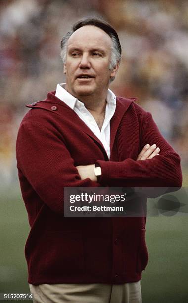 University of Southern California's football coach John Robinson, standing on a field during a game.