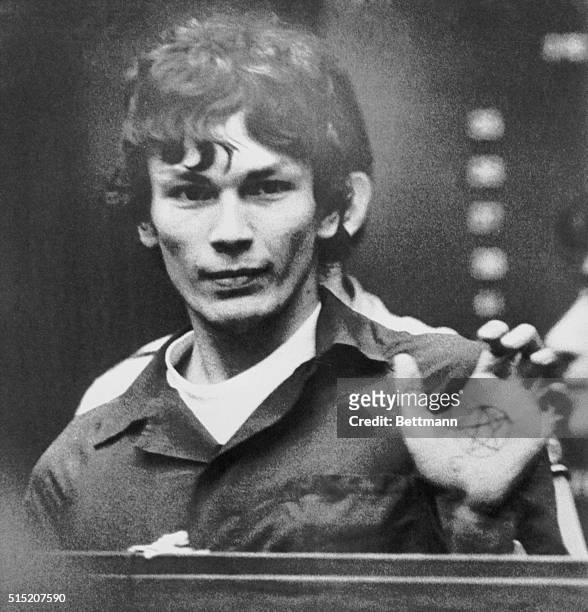 Suspect Richard Ramirez, accused of being the Los Angeles area serial killer called the "Night Stalker", flashes his left palm showing a pentagram, a...