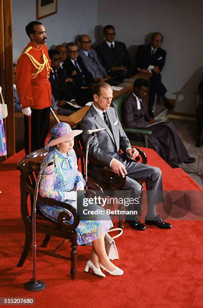 Kingston, Jamaica: Queen Elizabeth II reviews the Jamaican honor guard 2/13 on arrival at Kingston, first stop on an extensive tour that includes...