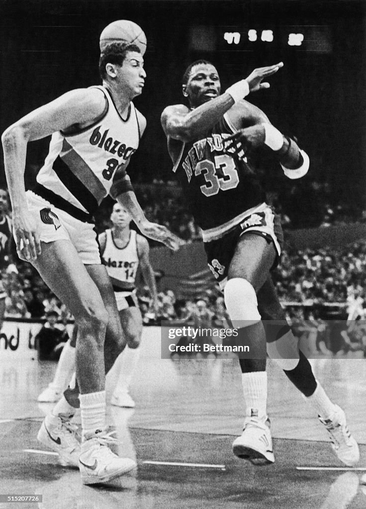 Sam Bowie Blocking Patrick Ewing During a Basketball Game