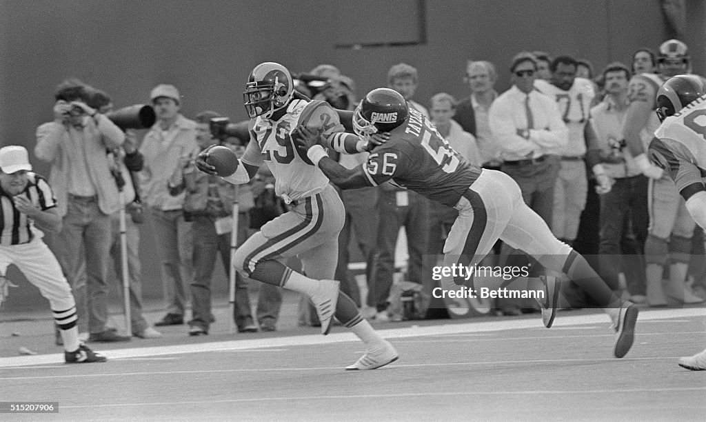 Lawrence Taylor Being Stopped by Eric Dickerson in Football Play