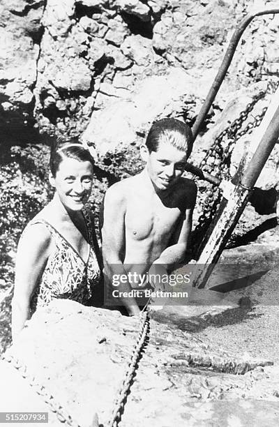 Smiling at you from a rock-bound pool at Eden Roc here are Beatrice Lillie, famous English actress who in private life is Lady Peel, and Bob Kennedy....