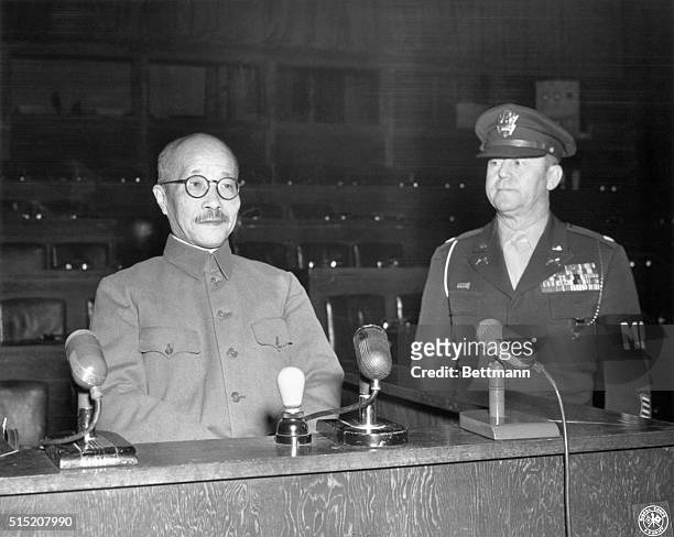 Tokyo, Japan: Hideki Tojo , wartime Premier of Japan, is shown in the witness chair at a war crimes trial in Tokyo. At right: Lt. Col. A.S....