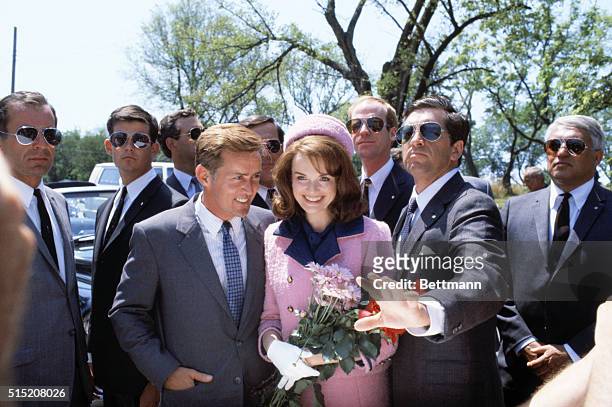 Dallas, Texas: Actor Martin Sheen playing John F. Kennedy and actress Blair Brown playing Jacqueline Kennedy, are surrounded by actors playing Secret...