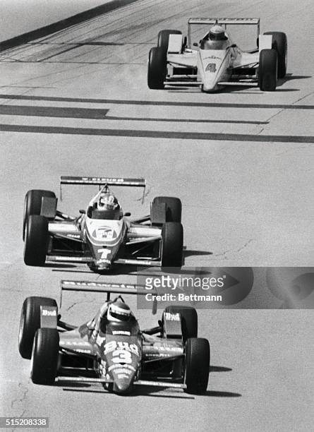 Indianapolis 500-Speedway, Ind.: Bobby Rahal takes lead into the first turn on the next-to-last lap of the Indianapolis 500 5/31, with Kevin Cogan...