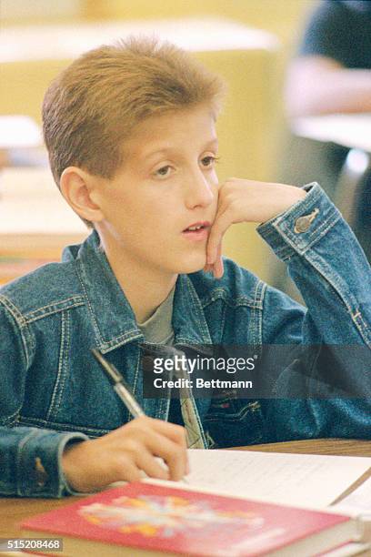 Fifteen-year-old Ryan White , who suffers from AIDS, looks over test being handed out his freshman math class at Hamilton Heights High School 8/31....