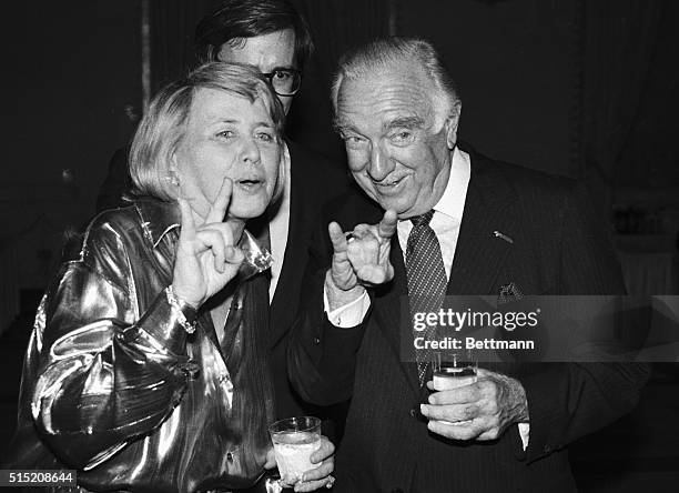 Former CBS news anchor Walter Cronkite and columnist Liz Smith sign during a celebrity roast for Cronkite at the Mayflower Hotel. Both Cronkite and...