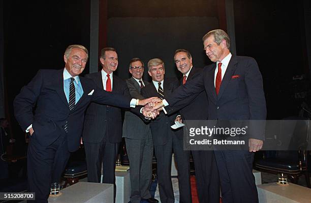 Houston, Texas: The six Republican presidential candidates join hands after first joint debate on TV show, Firing Line, in Houston, October 28. The...