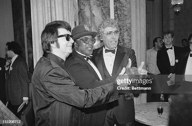 Rockabilly star Roy Orbison, Chicago blues singer Bo Diddley and Carl Perkins celebrate their induction into the Rock and Roll Hall of Fame at...