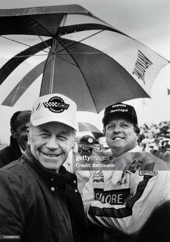 Chuck Yeager and A.J. Foyt Under Umbrella