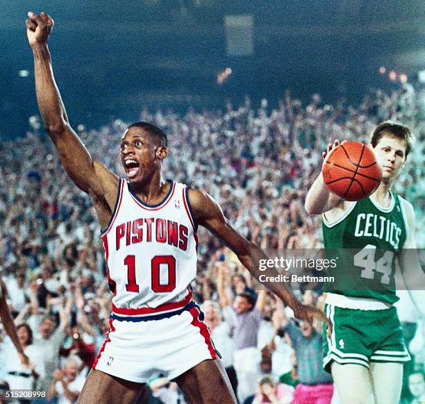 Pontiac, Mich.: Detroit Pistons' Dennis Rodman begins to celebrate as the clock ticks down with the Pistons winning 113-105 against the Boston...