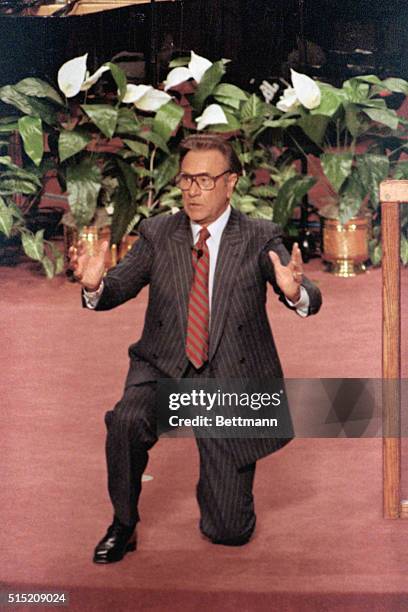 Rockwall, Texas: TV evangelist Oral Roberts gets down his knee while delivering his first sermon, April 5th, since descending from the prayer tower...