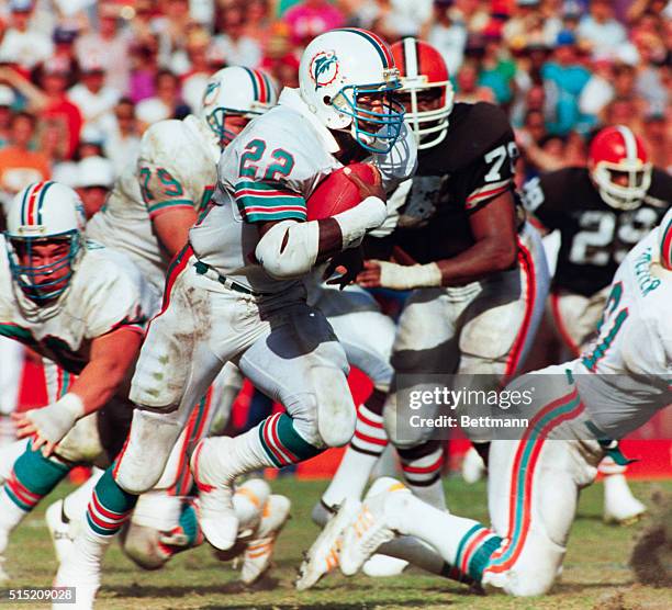 Miami: Dolphin Halfback Tony Nathan runs with a 39-yard pass reception from Miami Quarterback Dan Marino to set up Miami's winning touchdown against...