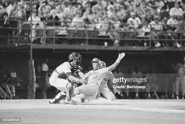 San Diego: Cincinnati Red's first baseman Dave Concepcion slides safely into home plate to beat the tag by the San Diego Padre's Benito Santiago...