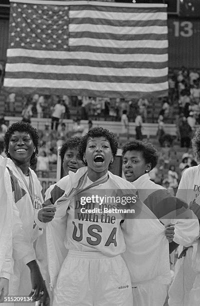 Cynthia Cooper flashes her gold medal and a message at presentation ceremonies honoring the gold medal US basketball team at the Pan Am Games. The...