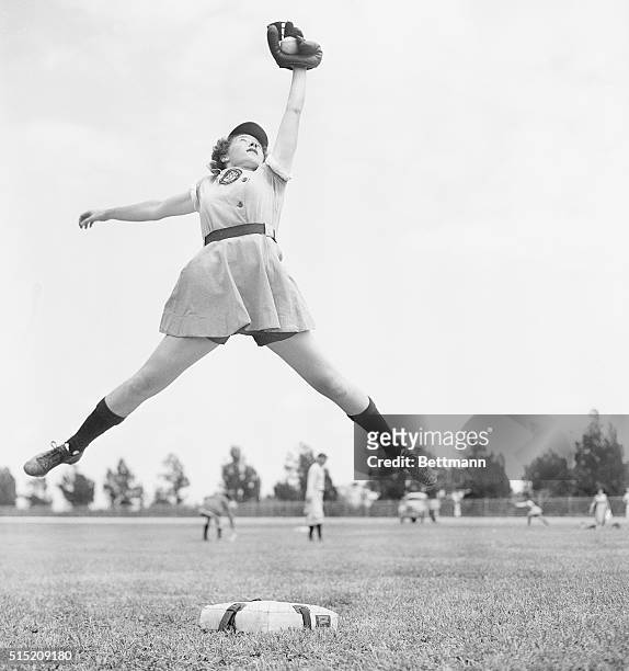 April 8, 1948 - Opa-Locka, Florida: Dorothy Harrell of Los Angeles, star shortstop of the Chicago Collens, spears a line drive during spring training...