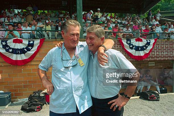 Ted Williams, , the great ball player for the Red Sox, embraces the new kid Carl Yastrzemski, at Doubleday Field in Copperstown. Yaz was inducted to...