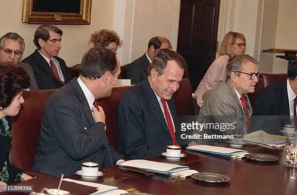 Washington, DC- President-elect George Bush cracks up while attending a cabinet meeting 11/10. Also laughing is Treasury Secretary Nicholas Brady....