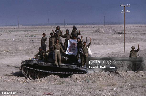 Iraqi troops give the ‘V' for victory as they stand atop their tank 9/27 following their advance of more than 10 miles inside Iranian territory....