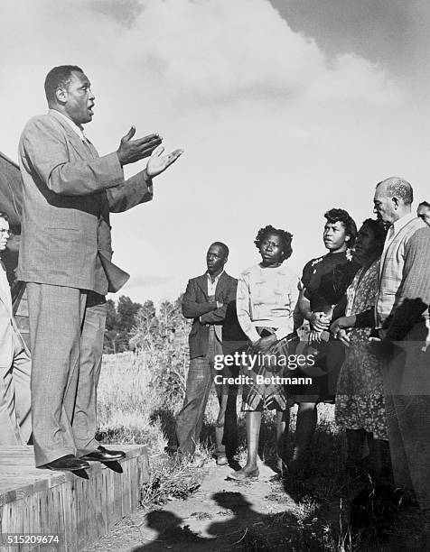 Singing from the steps of a small chapel in Eugene, Oregon, Paul Robeson entertains a small group after speaking on behalf of Henry Wallace, the...