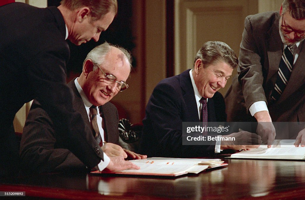 Gorbachev And Reagan Signing Pact