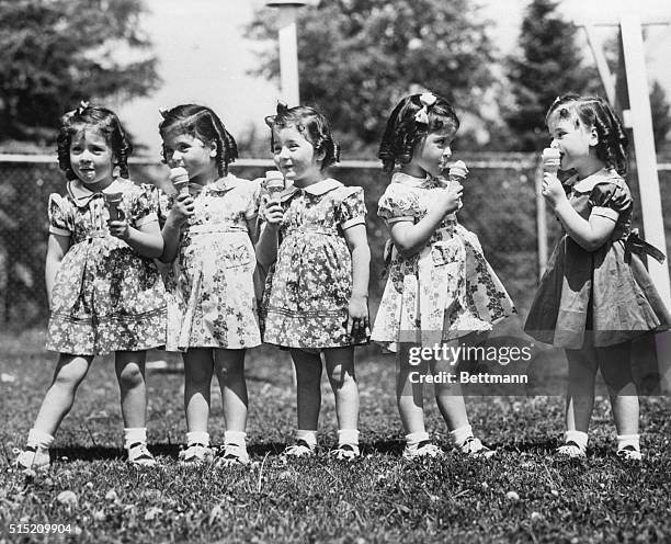 Callender, Ontario- On their fourth birthday, the fast-growing quintuplets received ice cream cones as a special added treat. Left to right: Emilie,...