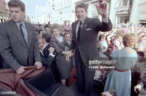 Moscow: President Reagan waves to Muscovites as first lady Nancy Reagan holds on May 29 during a walkabout in Moscow's popular Arbat Street on the...