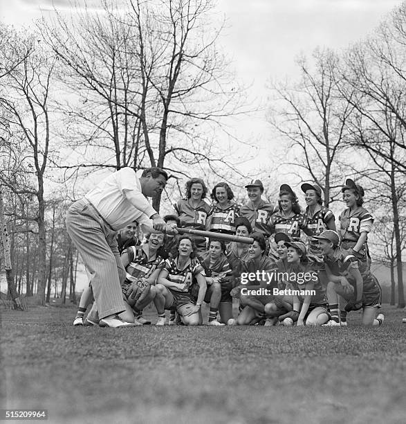 Members of the Americanettes Girls' Softball team are shown receiving a lesson in the Noble Art of swatting the apple from the famed Sultan of Swat...