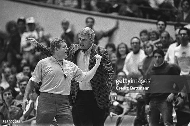 Bloomington, Indiana: Indiana University coach Bob Knight argues with official Jim Burr, a Big Ten referee, after Knight received a technical for...