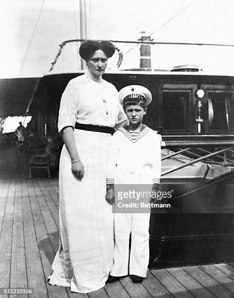 Russian Empress Alexandra stands with her son, Czarevitch Alexis, on a boat. The photograph was taken by Russian Czar Nicholas II.