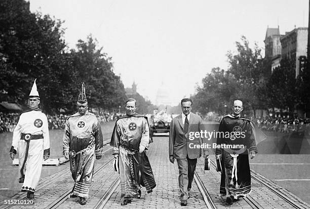 Washington, DC: Above is pictured a general view of the Ku Klux Klan parade along Pennsylvania Avenue. It was estimated that nearly sixty thoudand...