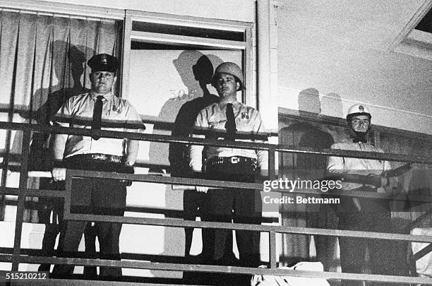 Memphis, TN: Police stand guard on balcony of motel in which Negro leader Dr. Martin Luther King was shot 4/4. King was felled by a single shot as he...