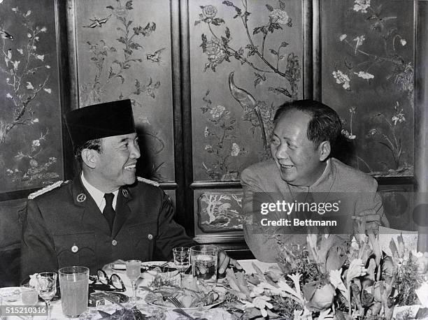 Peiping, China: President Dr. Sukarno of Indonesia, left, is seen chatting with Chairman Mao Tse-Tung of the People's Republic of China during a...