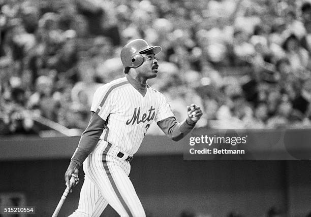 New York, NY- New York Mets' first baseman Eddie Murray watches his first-inning home run sail out of Shea Stadium. The homer, which came off of San...