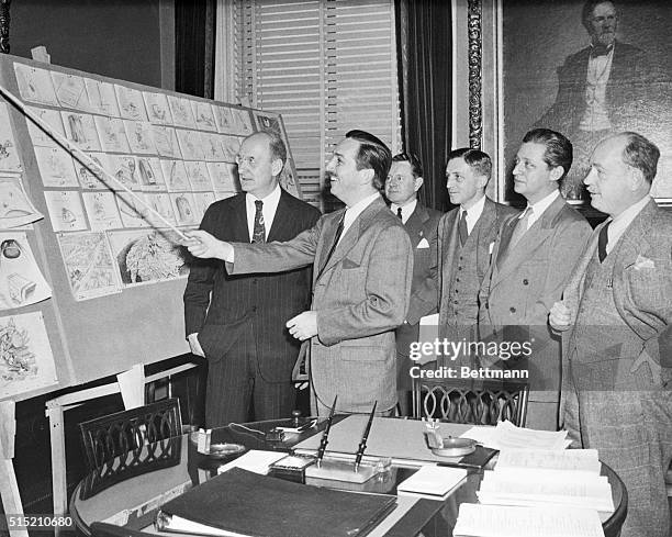 Secretary of Treasury Henry Morgenthau, Jr., Walt Disney, Assistant Secretary of Treasury, John L. Sullivan, Assistant to the Secretary George...