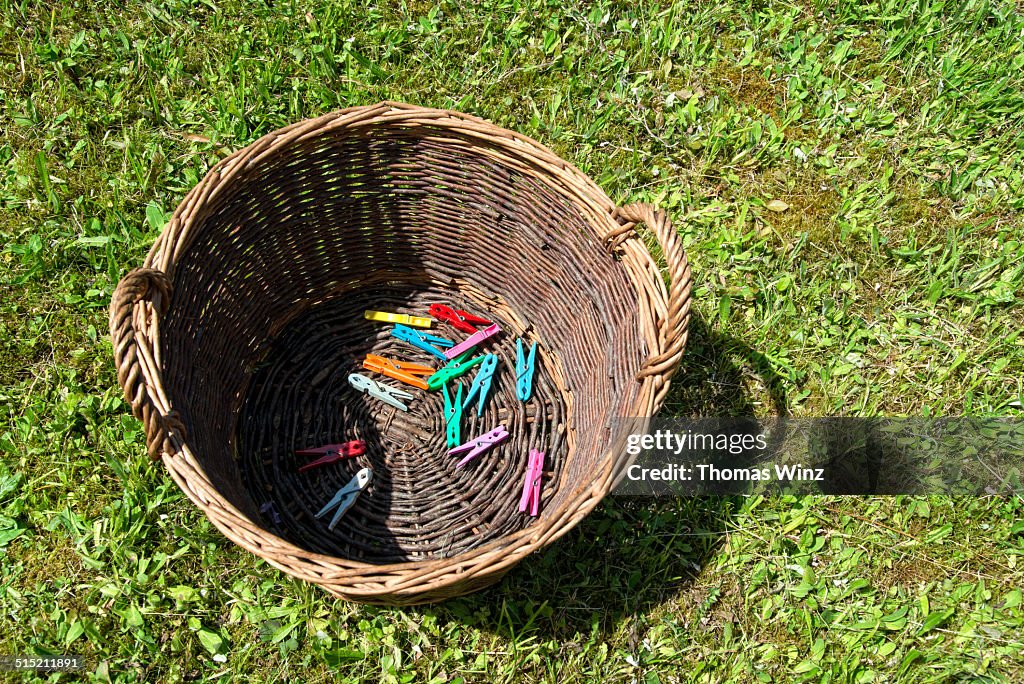 Clothes pins in a basket