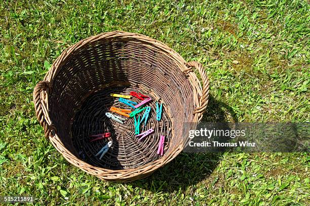 clothes pins in a basket - peg stock pictures, royalty-free photos & images