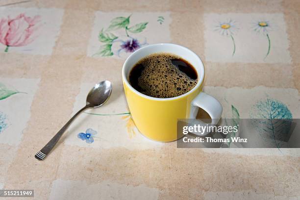 cup of coffee on vinyl table cloth - teaspoon stock pictures, royalty-free photos & images