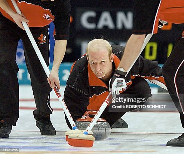 Kevin Martin the skip for curling team from Canada closely watches the delivery of his stone 22 February 2002 during his team's gold medal match...