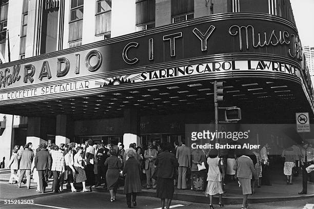 Crowd outside Radio City Music Hall, on the Avenue of the Americas , Manhattan, New York City, 6th December 1980.