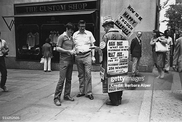 Harry Britton , founder of the 'International Association of Dissatisfied Husbands', campaigns for 'Husband Liberation' on Fifth Avenue, New York,...