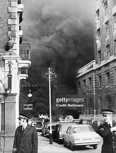 London, England- A large column of dense black smoke rises after a car-bomb explosion at the Agriculture Ministry. Damage from the blast covered a...