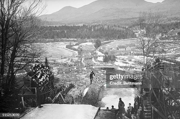 Lake Placid, NY- Floating high above the crowd over the intervale jump at Lake Placid, Birger Ruud of Norway is seen here making the leap which won...