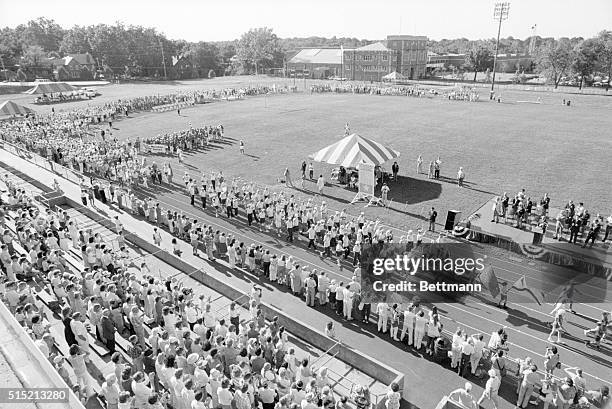 St. Louis, Missouri- Over 3,000 athletes 55 and older from 45 states and Canada, parade past the podium during the opening ceremonies, 6/27 of the...