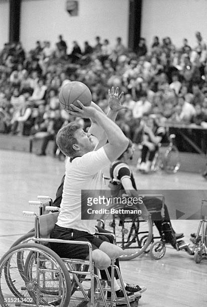 Springfield, IL- A member of the Springfield Spoke Jockeys, a wheelchair basketball team, tries for a basket during a recent game against the...