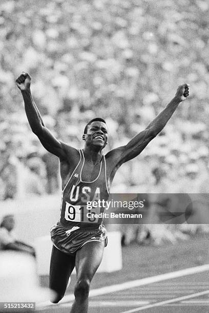 Los Angeles, CA- Carl Lewis, shown here at the finish line, gave a crowd of 92,000 the run it paid to see when he won a gold medal in the men's 100m...