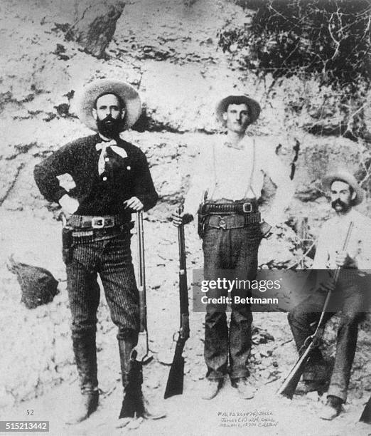 Outlaw Jesse James with members of his gang, probably two of the Younger brothers.